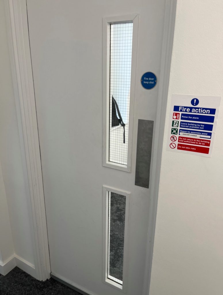 London student accommodation fire safety - dorm room fire exit and signage. Fire Door Ratings. Fire Compartmentation.